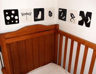black and white images around baby cot